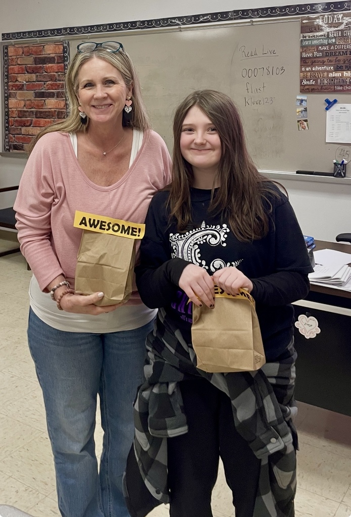 Blazer of Week teacher and student with bag of treats