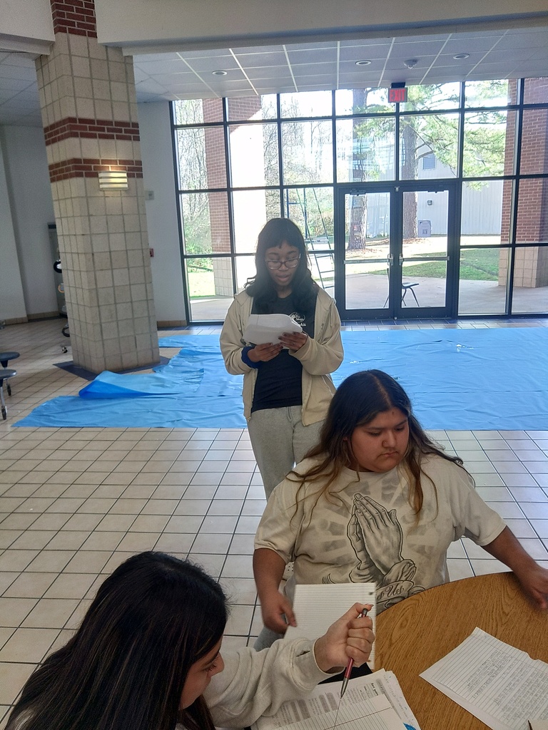 students going over findings of egg-drop activity