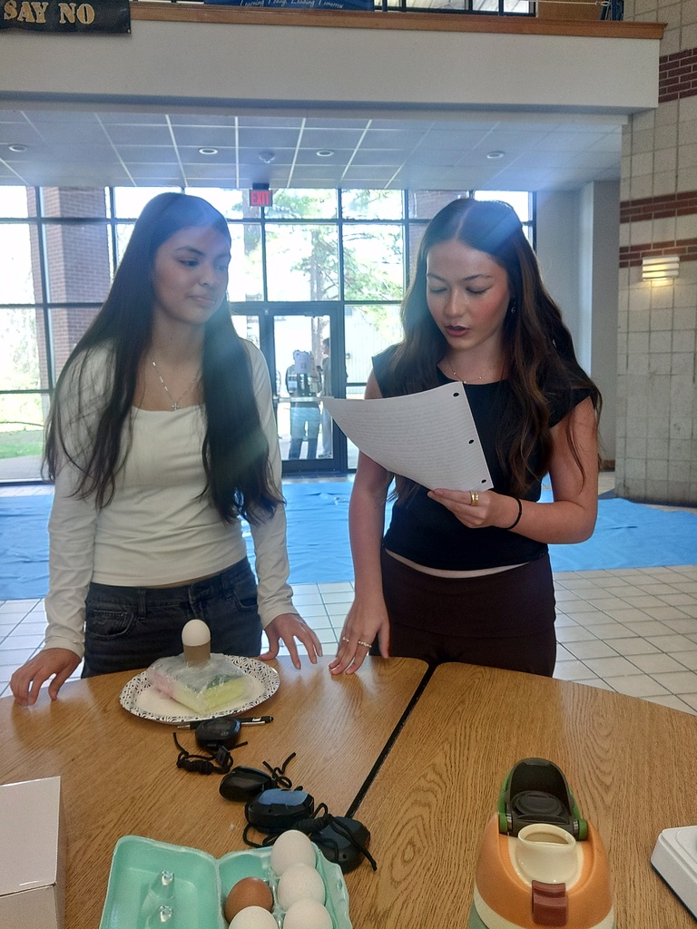 students going over findings of egg-drop activity