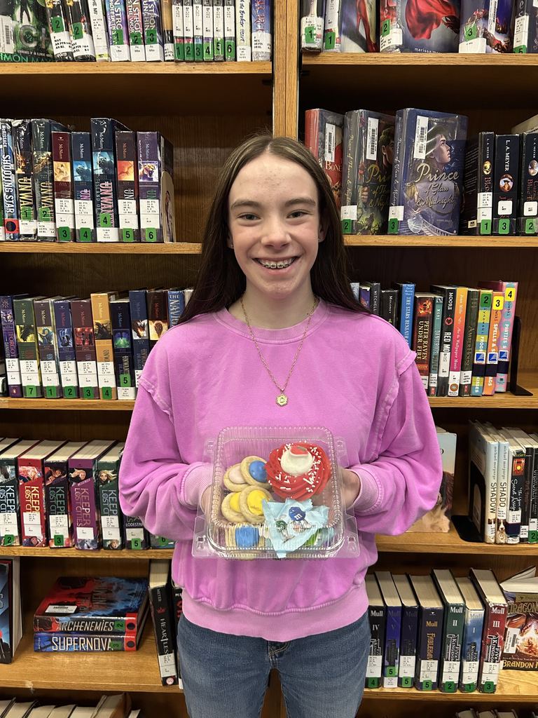 reading challenge winner holding treats