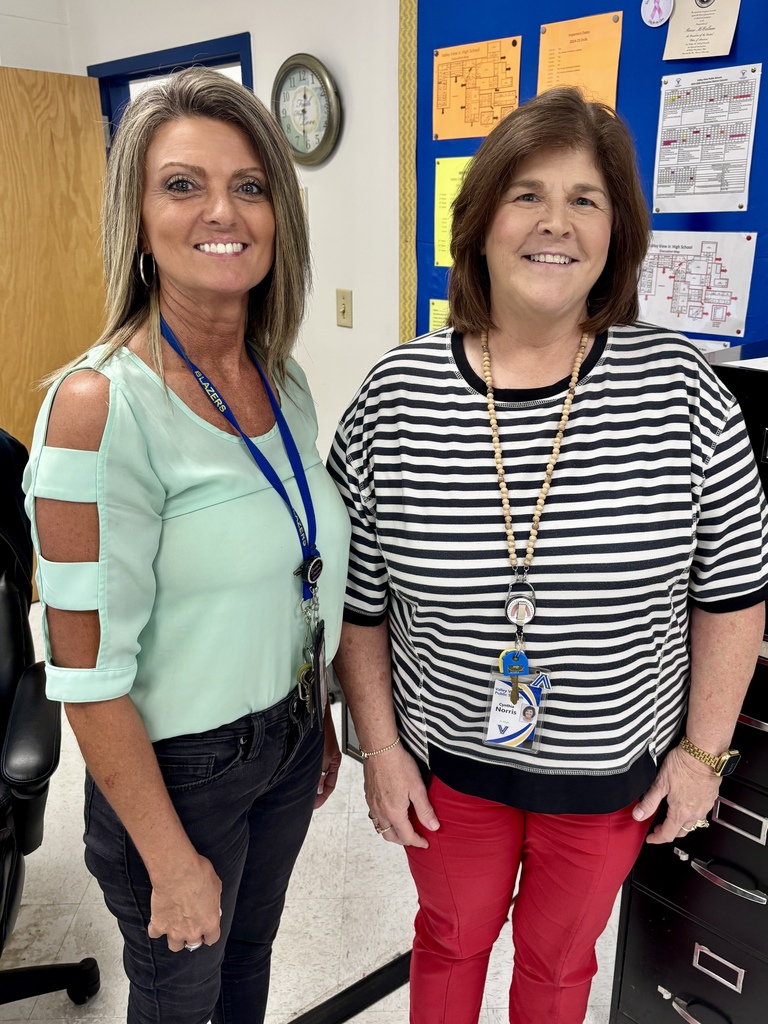 admin assistants standing in the office