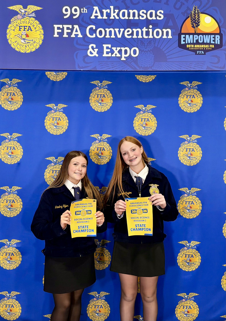 the two state champs holding award certificates