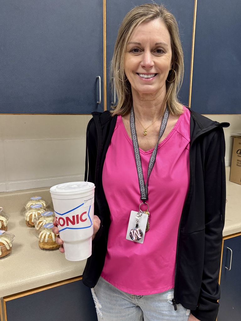 teacher holding Sonic drink