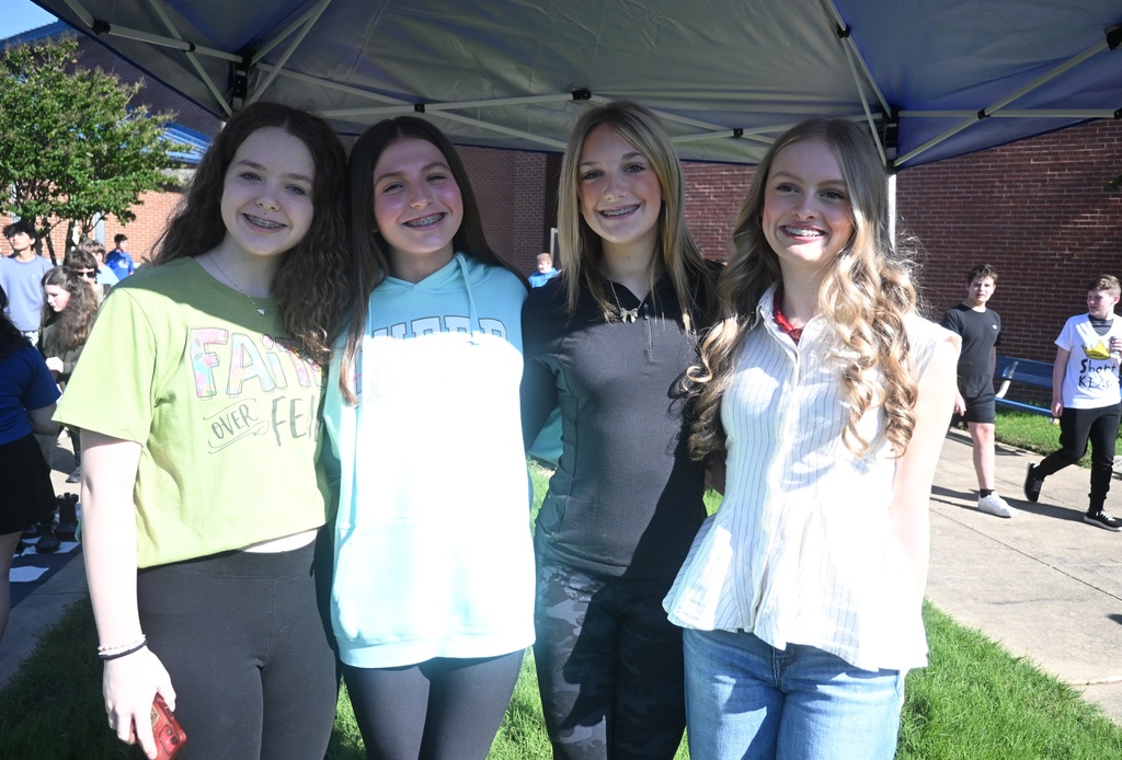 four girls standing together