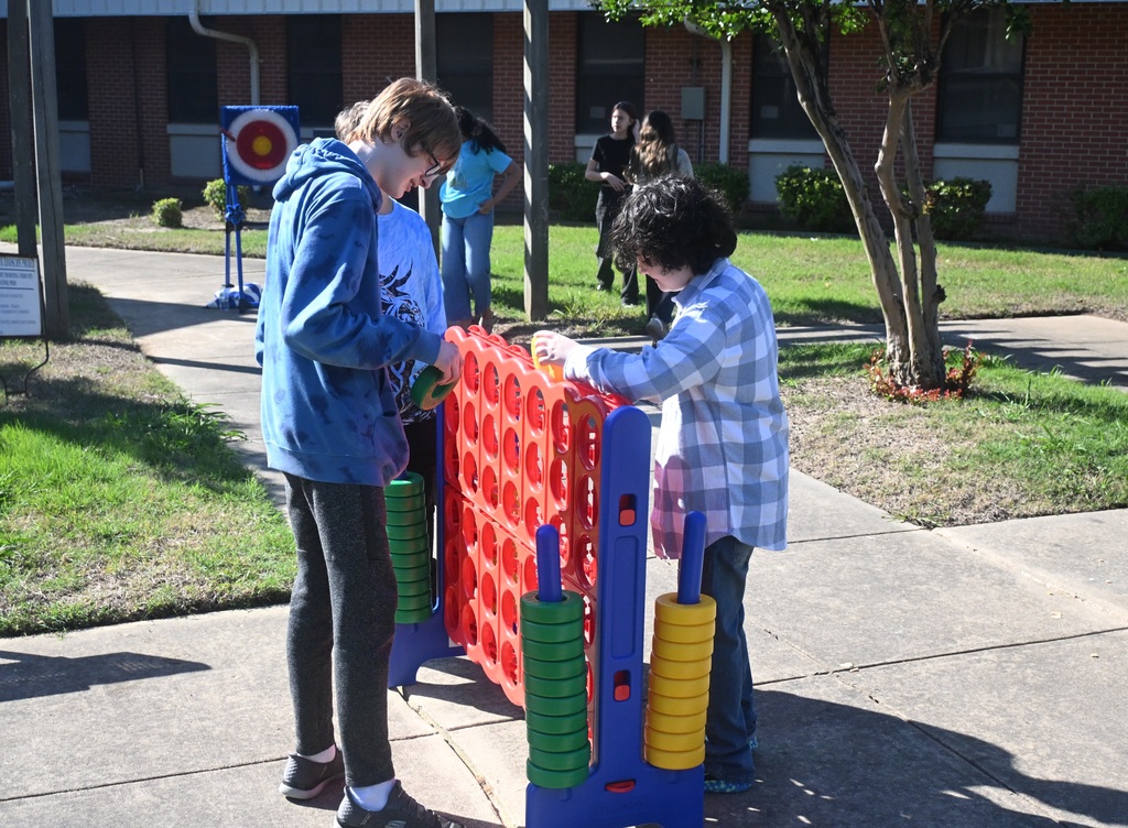 two kids playing Connect Four