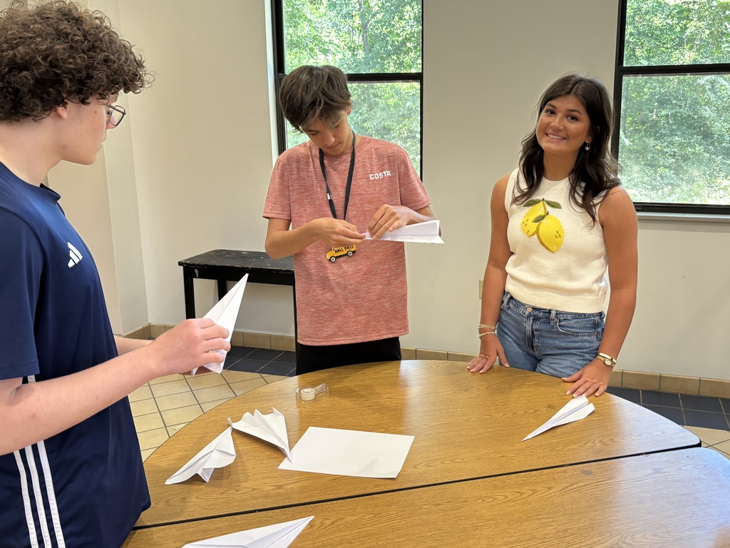 students folding planes