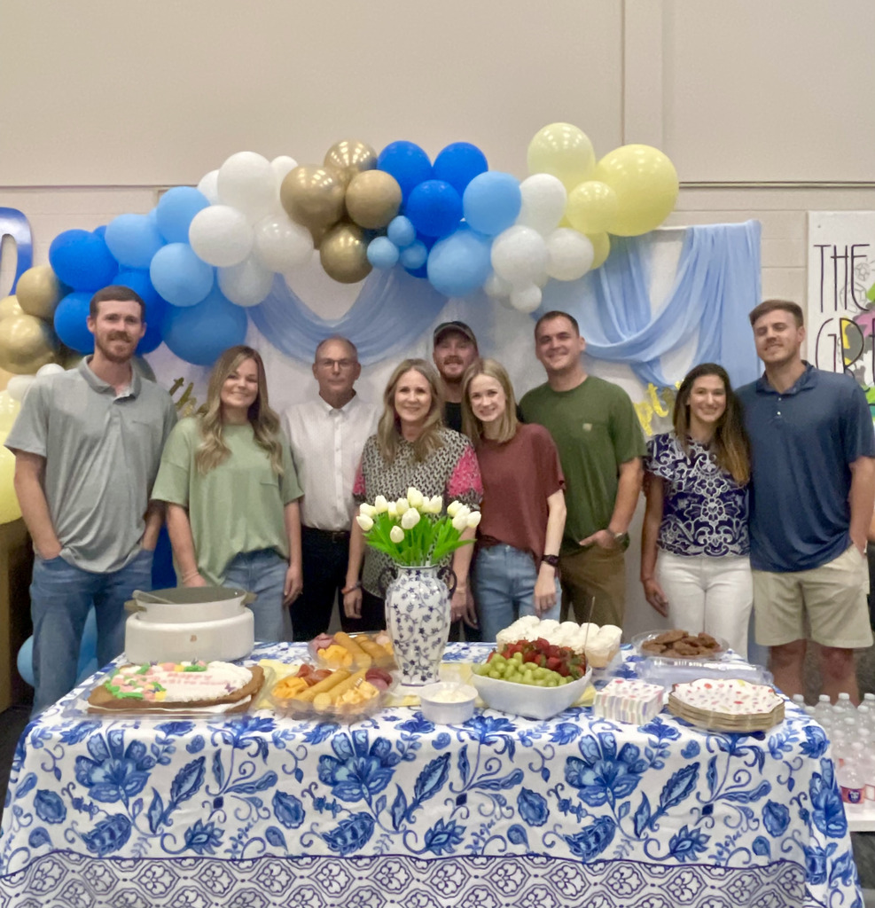 Kim with family at retirement reception 