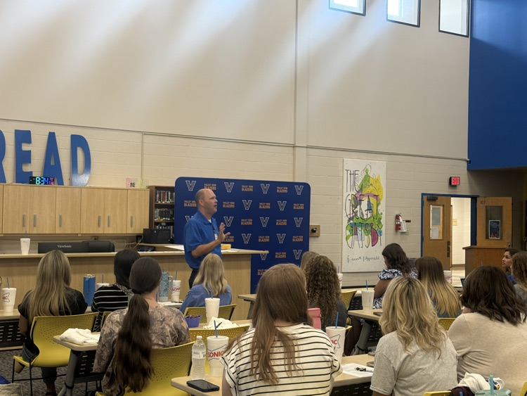 Superintendent speaking to new employees