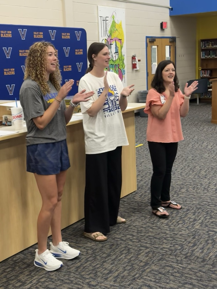 Staff singing Alma Mater.