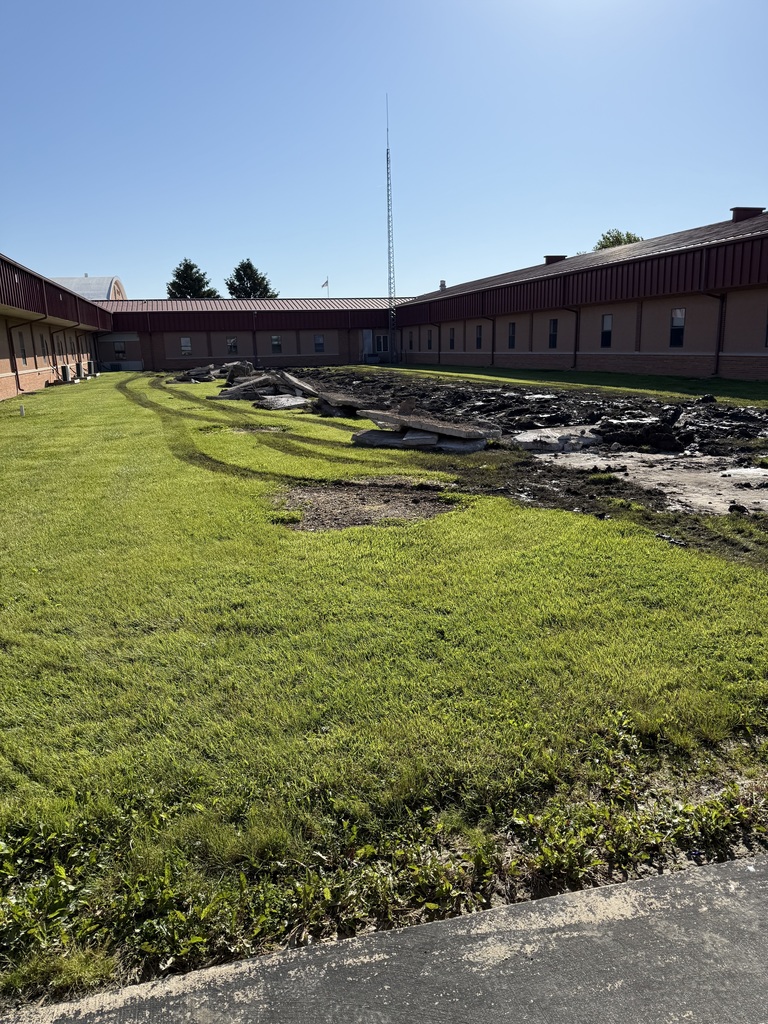 Working on the High School drainage system.