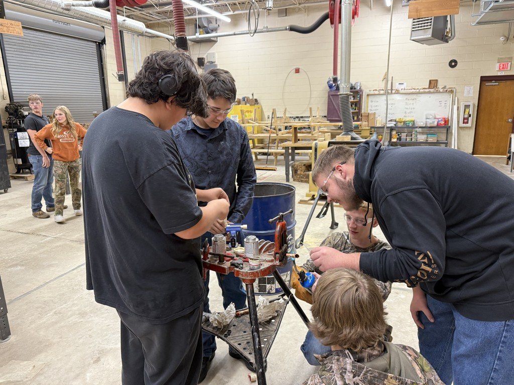 Students working in the VBHS Shop together on a plumbing project
