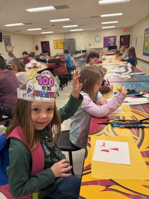 students in the cafeteria during afterschool working on project