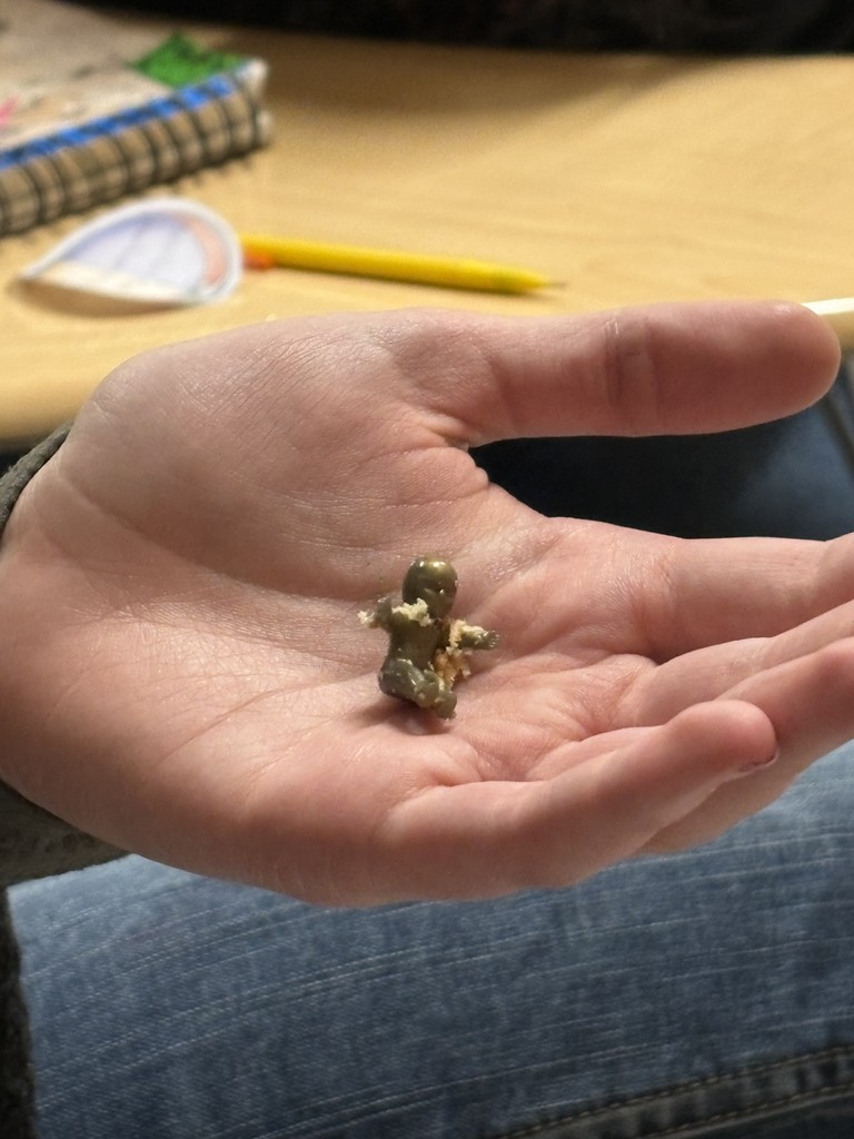baby jesus in hand of student found in King CAke