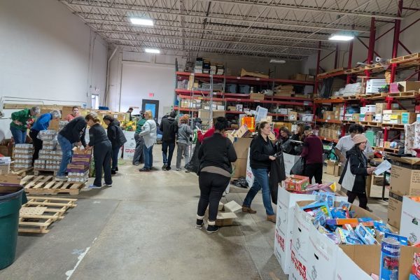 Volunteers assembling Migrant Christmas Baskets