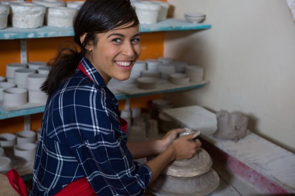 Girl making pottery