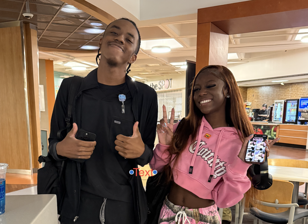 Two students give a thumbs up to their first day at Washtenaw Community Collee 