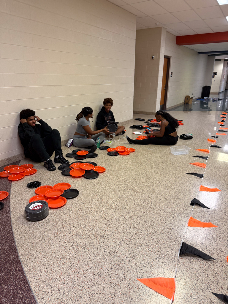 kids in hall putting together decore