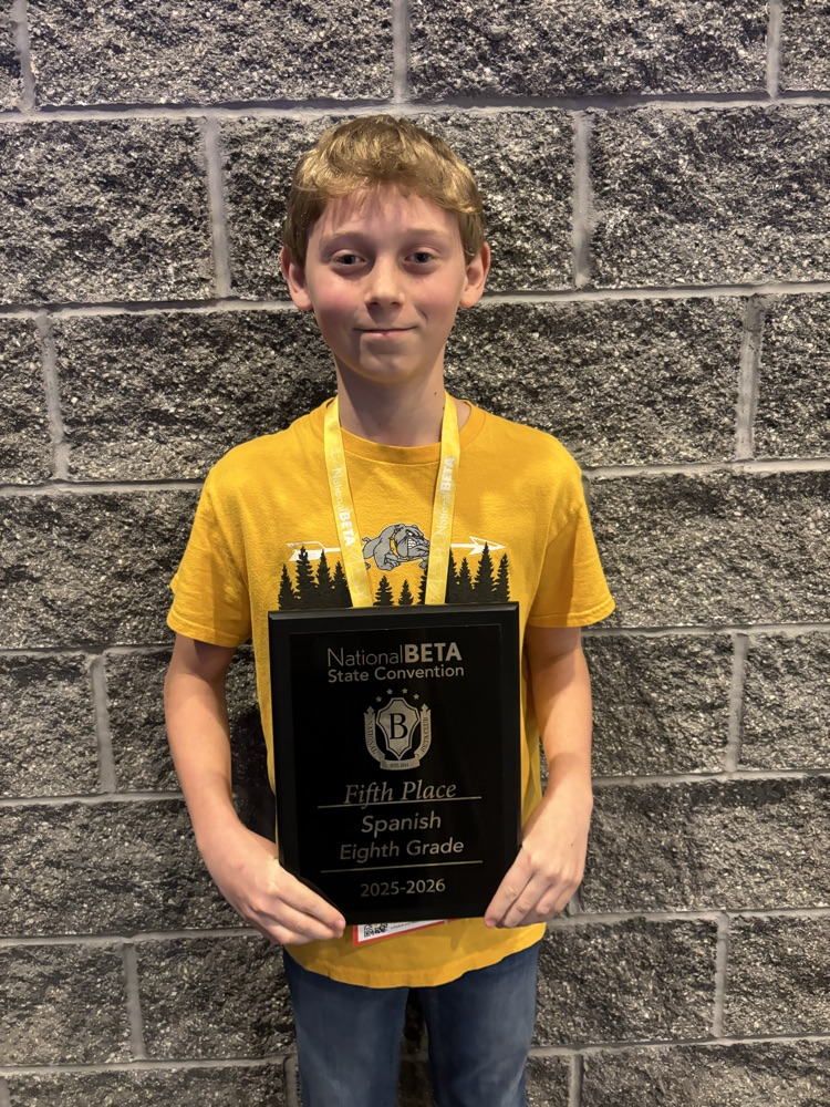 Spencer Rolf with his 5th place plaque in Spanish  