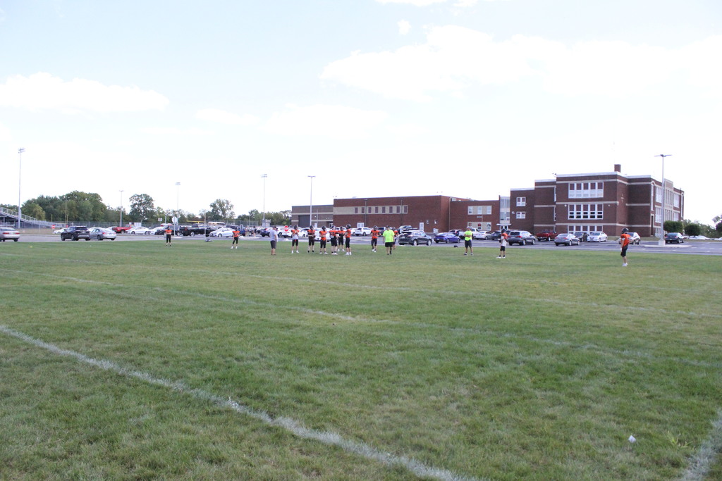 Middle school football practices on the new practice space.