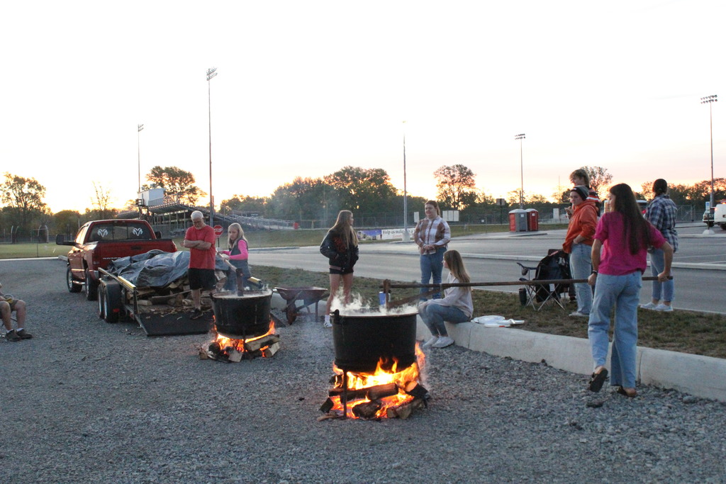 Students rising bright and early to stir the apple butter.