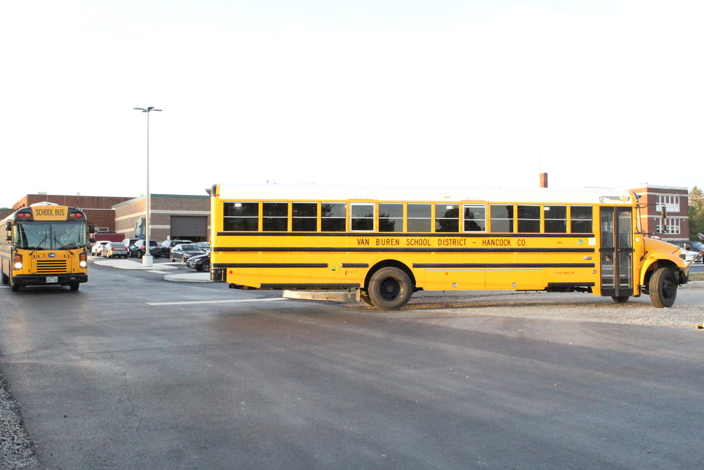 Buses return to the bus barn after dropping off students in the morning.
