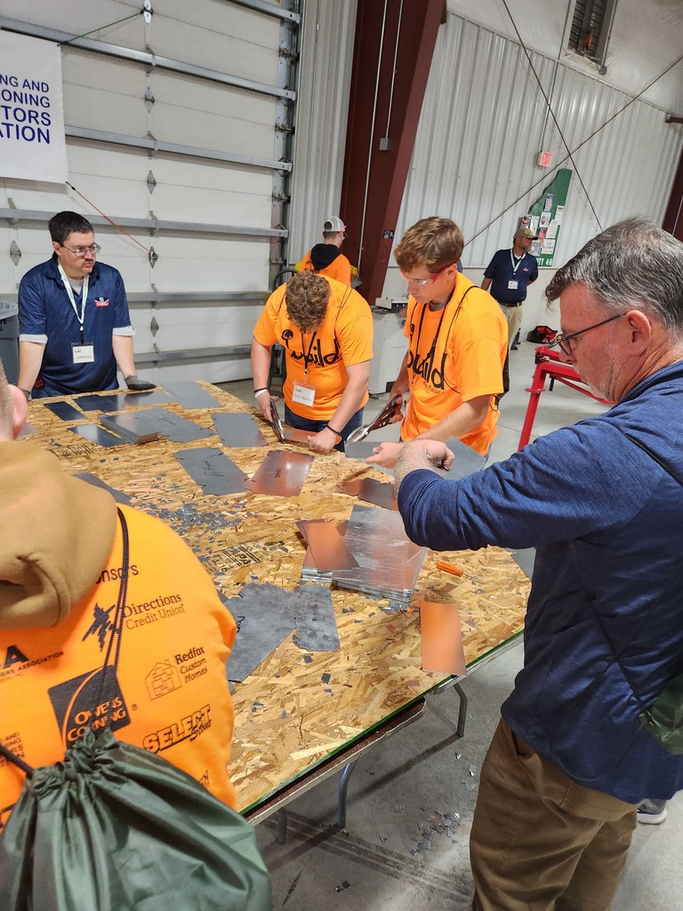 Mr. Evans joins in the fun at the HVAC booth.