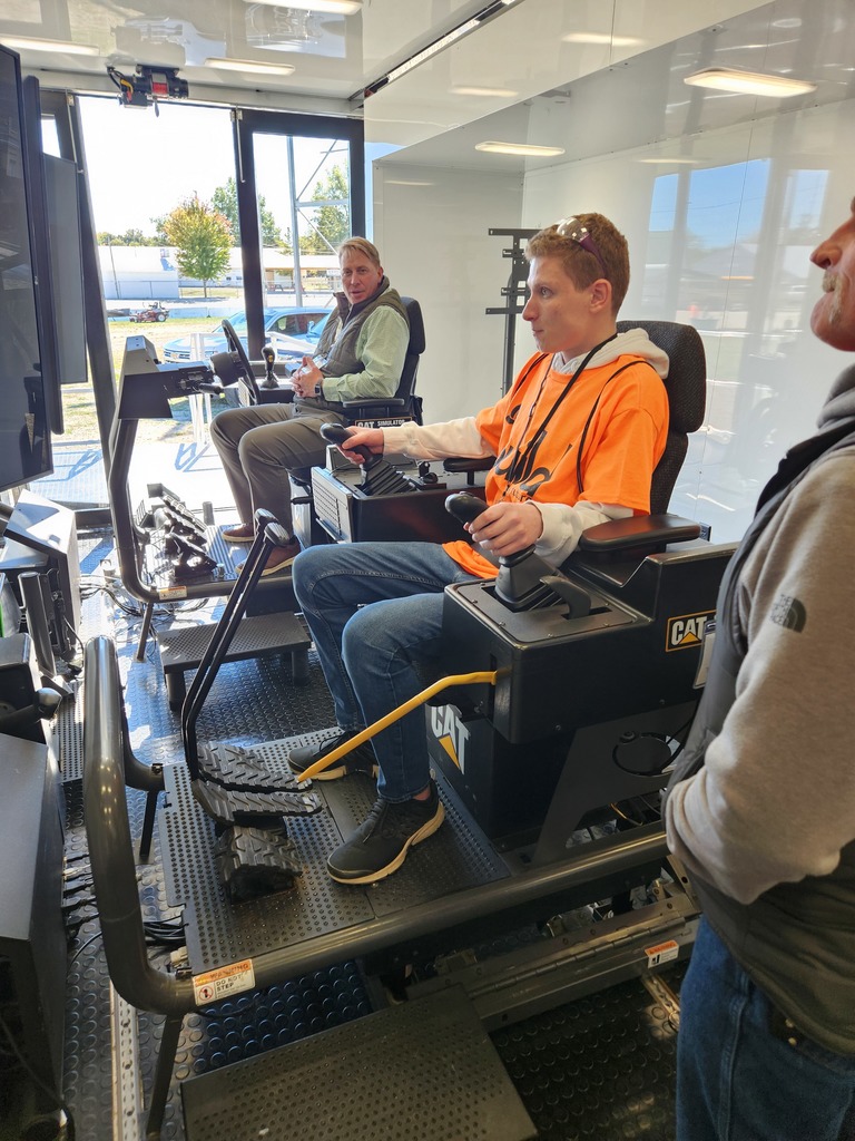 Another student practices on the CAT simulator.