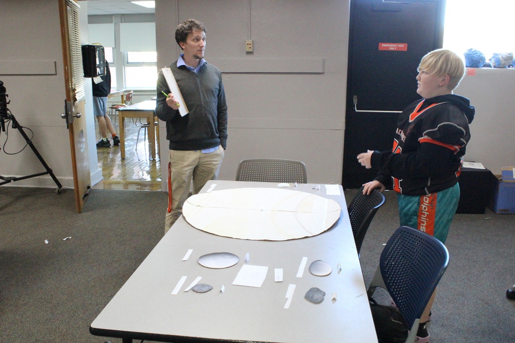 Mr. Stanford and a student discuss the project.