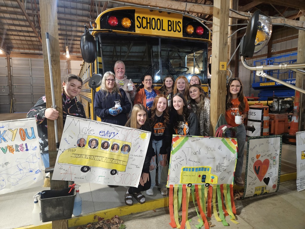 LEADS students present gifts and posters to the bus drivers.