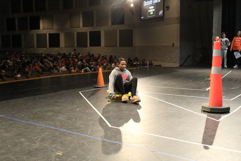 A student maneuvers through the bus obstacle course.
