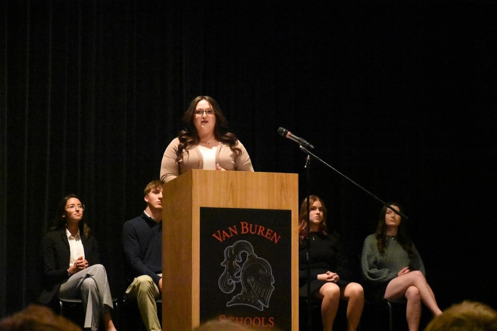 Van Buren graduate Kaylee (Arbaugh) Schleucher speaks at the induction ceremony.