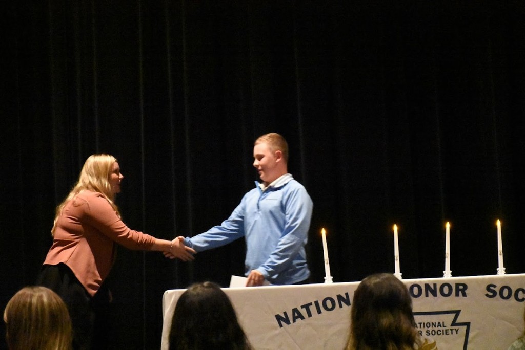 Middle school principal Mrs. Jenn Barrett welcomes a student into National Junior Honor Society.