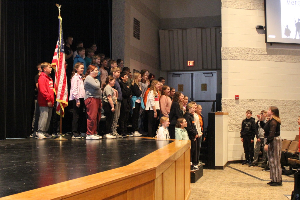 Students led the Pledge of Allegiance and singing of "The Star-Spangled Banner."