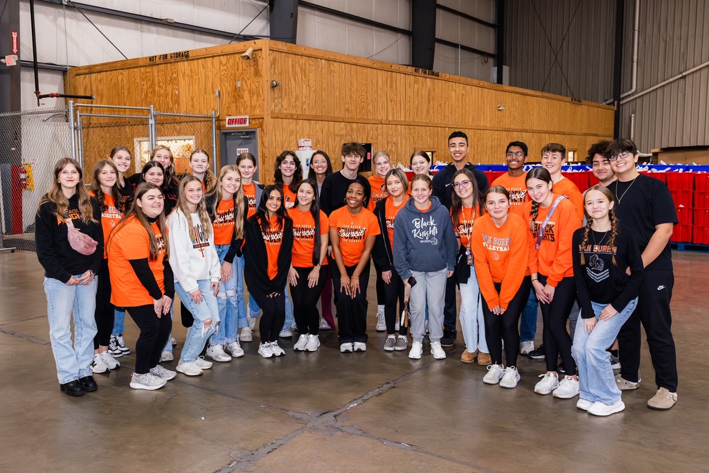 Student Council members pose for a group picture after filling the bags of food.