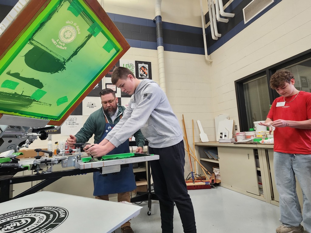 A student practices screenprinting in the FLOW studio.