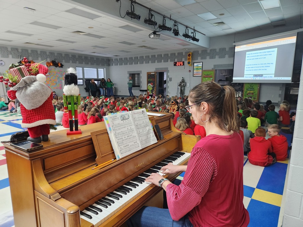 Elementary students sing carols at the end of the day.