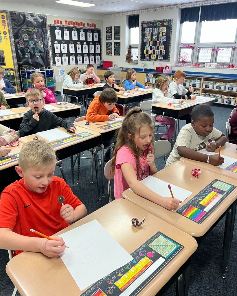Students determine how many licks it takes to get to the center of a Tootsie Pop.