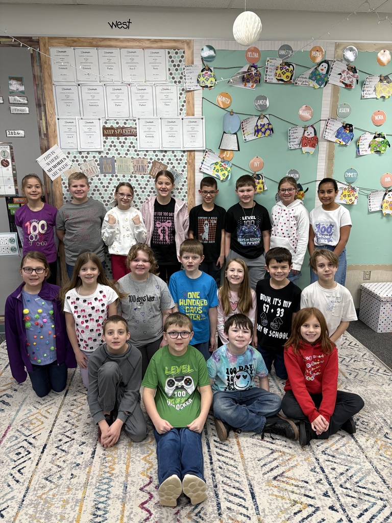 Students model their 100th Day-inspired t-shirts.
