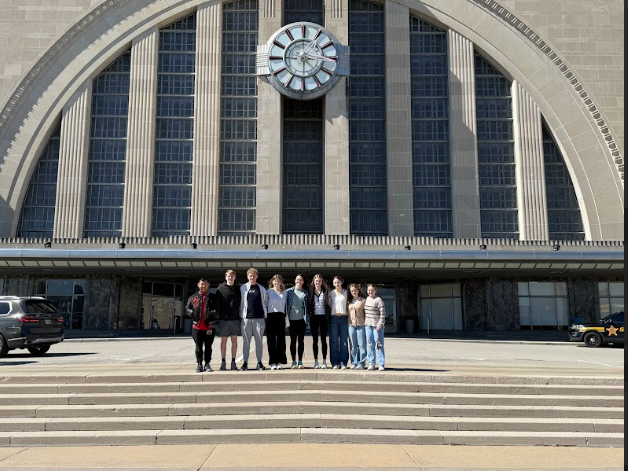 The students who went on the trip pose in front of the Cincinnati Museum Center.