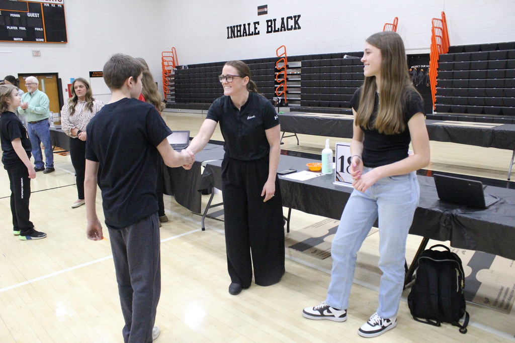 Introductions, including handshakes, began every round.
