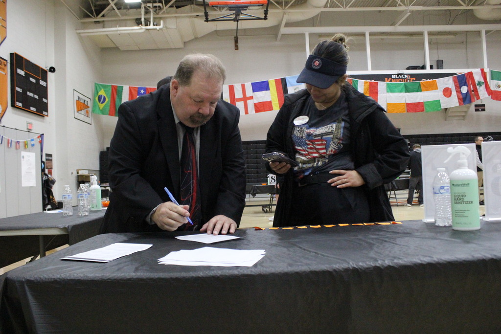 Judges tally the score for a participant before moving on to the next student.