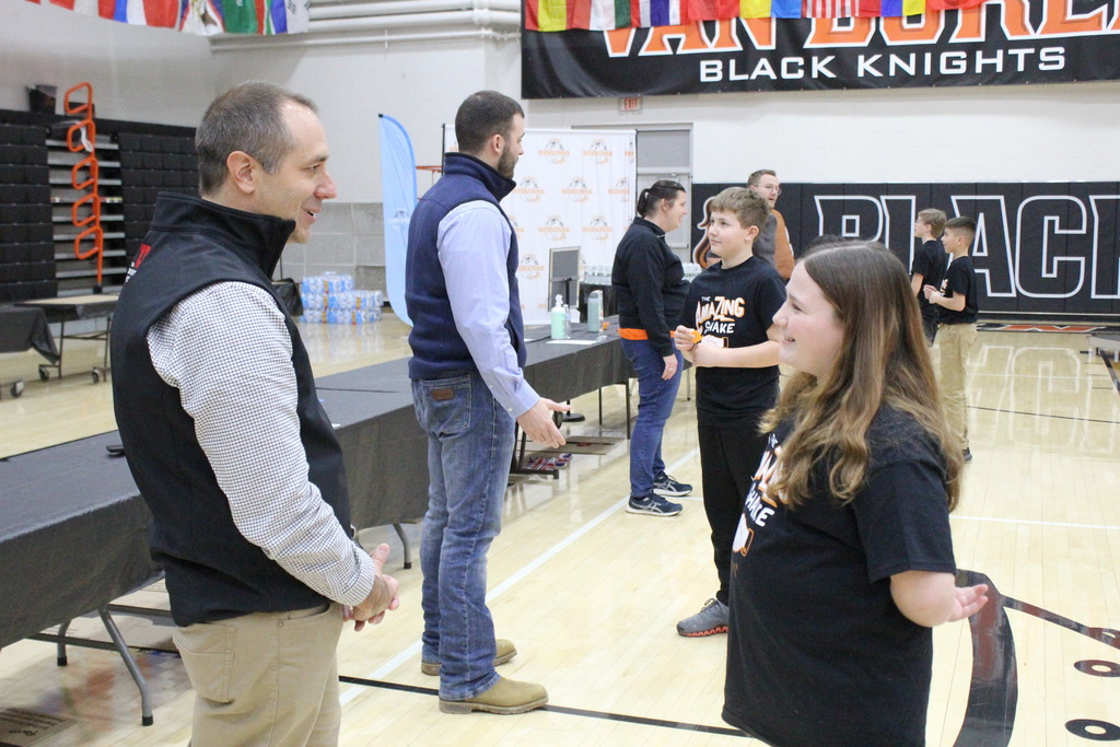 Students interact with the judges.