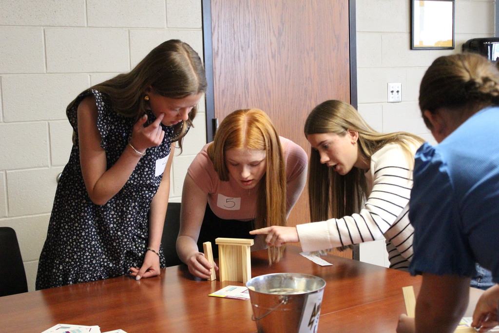 Students work together during the Action-Based Teamwork Challenge.