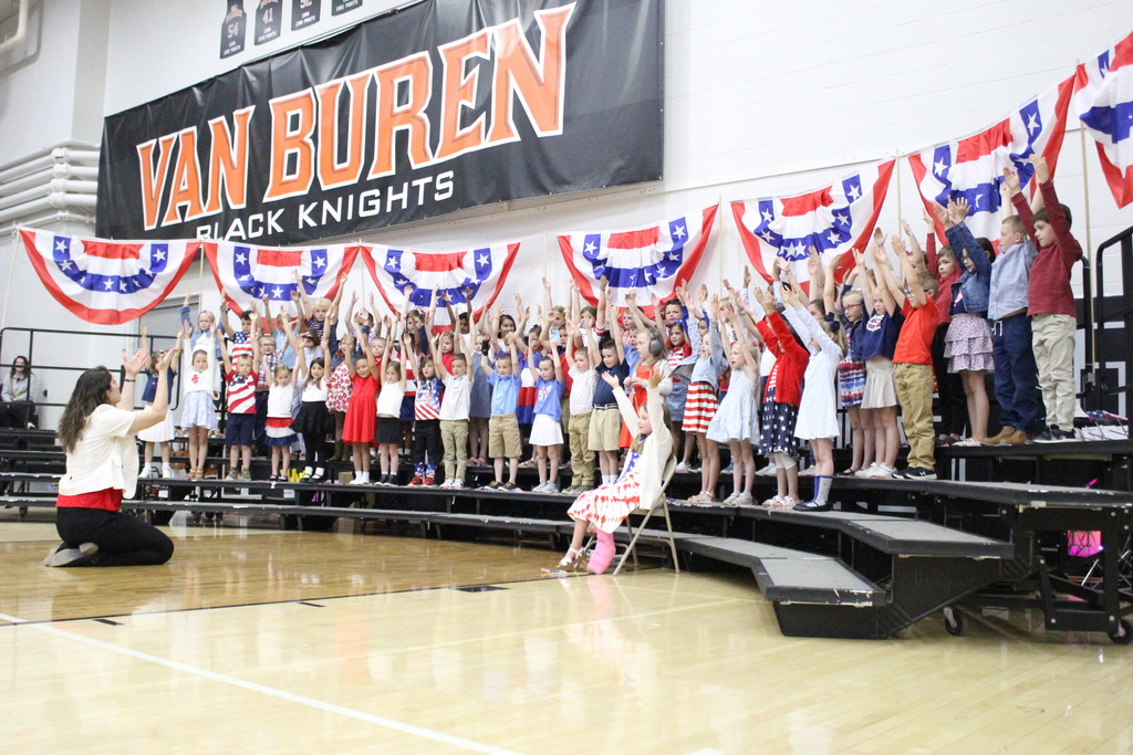 Students sing "America."