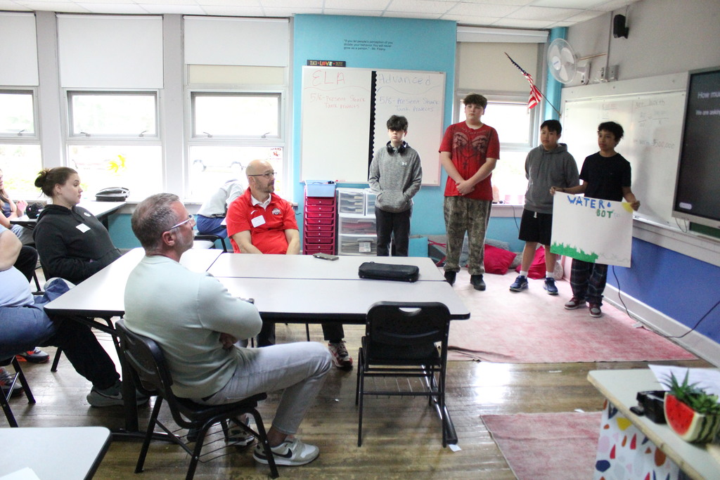 Students pitch their products during English class.