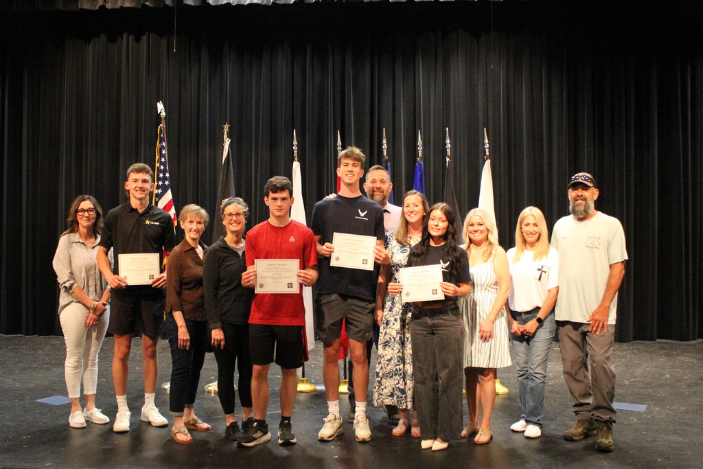 All of the signees pose with their families after the ceremony.