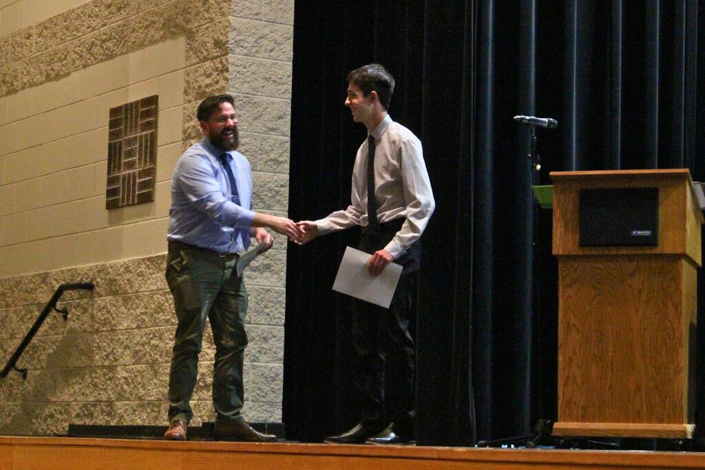 Andrew shakes hands with Mr. Hafner after choosing him as his most influential teacher.