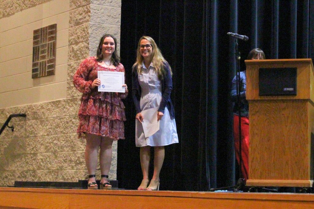 Josalyn, winner of the Franks Farm Educational Trust Scholarship, poses with presenter Angela Middleton.