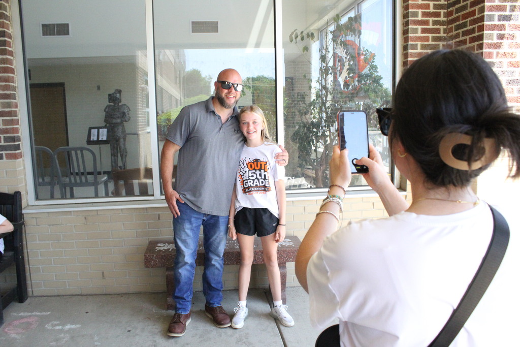 A family takes a picture.