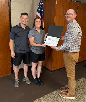 Jamie and Danielle Doxsey receive the OSBA award from board member Michael Leifheit.